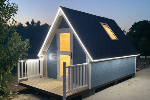 A-Frame cabin in dark navy with LED trim and skylight at dusk
